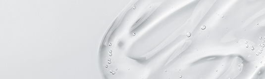 Serum gel smear on blue background. Cosmetic transparent gel ser