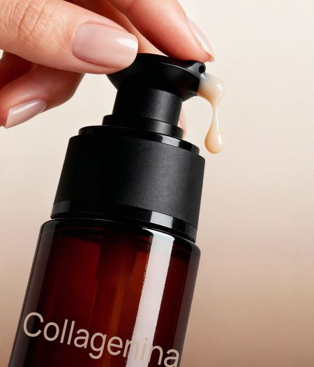Close-up of Collagenina Serum pump dispenser releasing the concentrated serum.